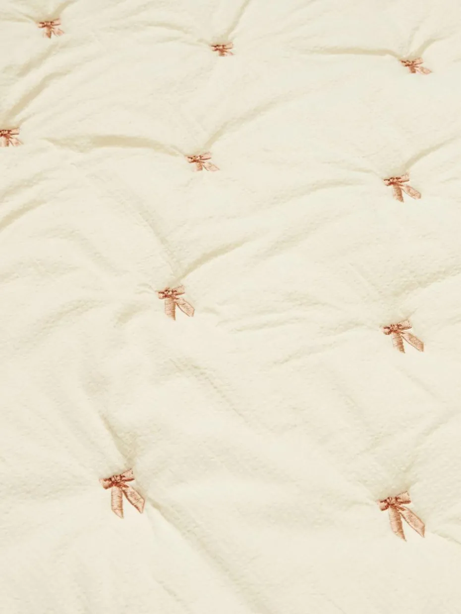 Gesteppte Kuscheldecke Bows aus Bio-Baumwolle