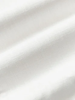 Handgewebte Baumwoll-Kissenhülle Terre mit dekorativer Naht