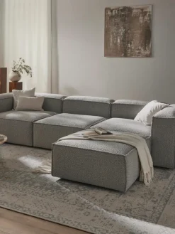 Modulares Sofa Lennon (4-Sitzer) aus Bouclé mit Hocker (links/rechts)